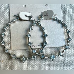 Silver hoop earrings with rhinestones. 1.5’ diameter